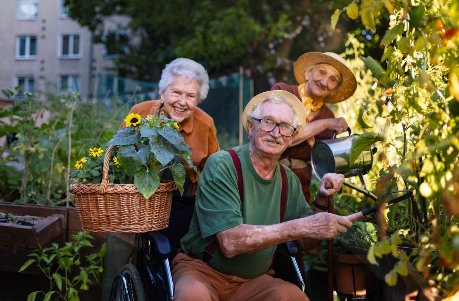 A group of residents in memory care enjoy tending to the gardens.
